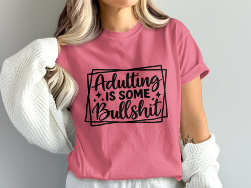 Pink t-shirt with black text that reads "Adulting is some Bullshit".