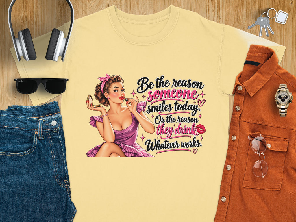 Yellow t-shirt with vintage pin-up graphic and text "Be the reason someone smiles today."