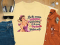 Yellow t-shirt with vintage pin-up graphic and text "Be the reason someone smiles today."