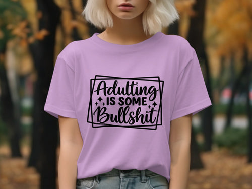 Purple t-shirt with "Adulting Is Some Bullshit" text design.