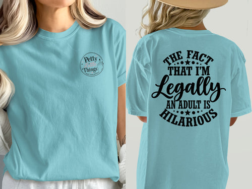 Light blue t-shirt with "Petty Little Things" on front and "The fact that I'm legally an adult is hilarious" on back.