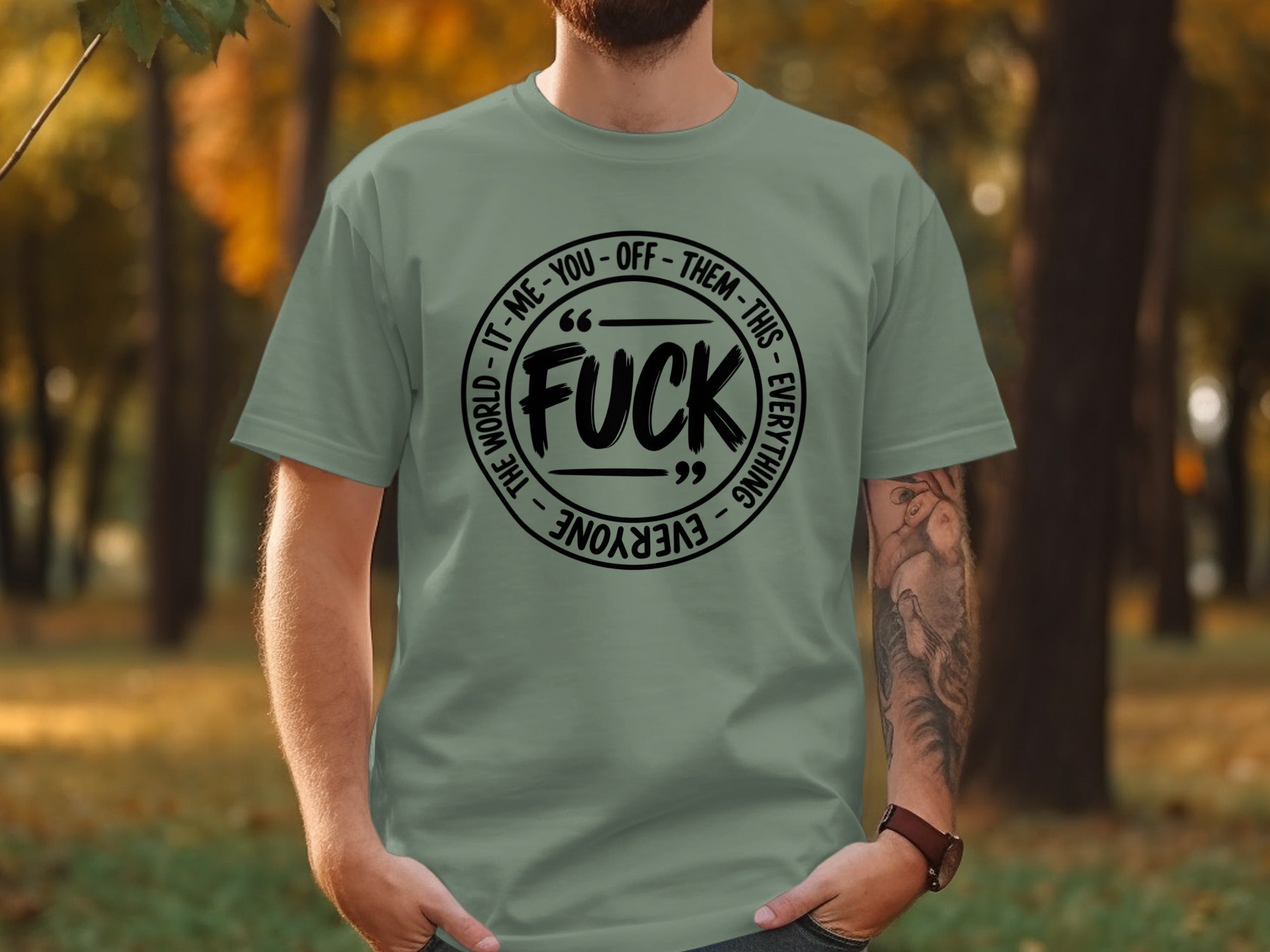Grey t-shirt with black circular text reading "FUCK IT-ME-YOU-OFF-THEM-THIS-EVERYTHING-EVERYONE THE WORLD".