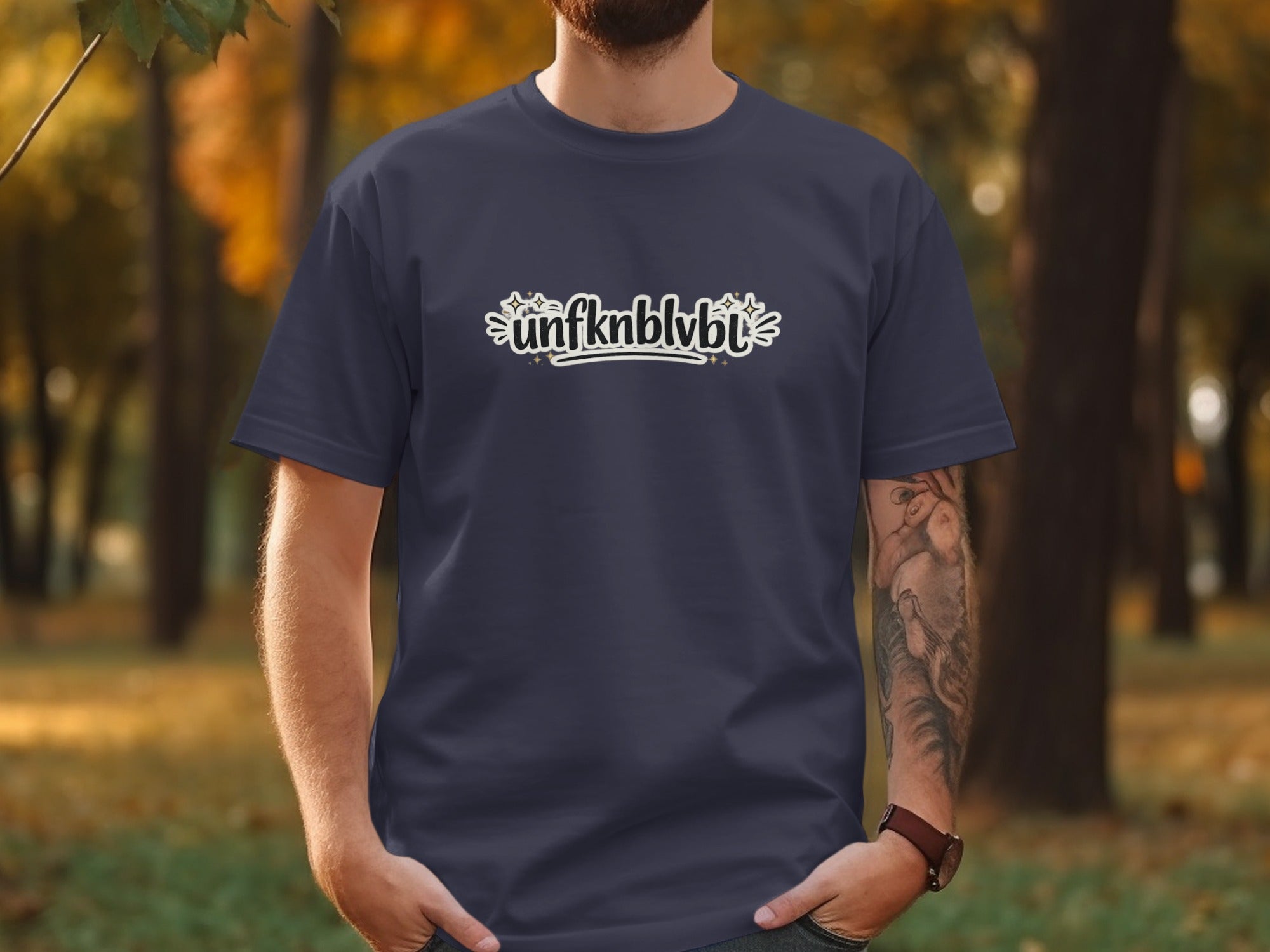 Navy t-shirt with white text "unfknblvbt" and star accents.
