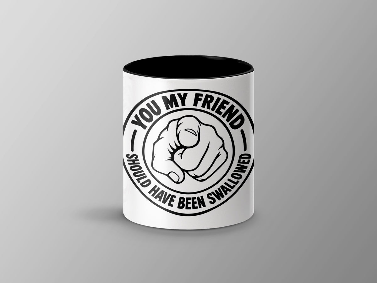 White mug with black interior featuring a pointing fist and text "You My Friend Should Have Been Swallowed".