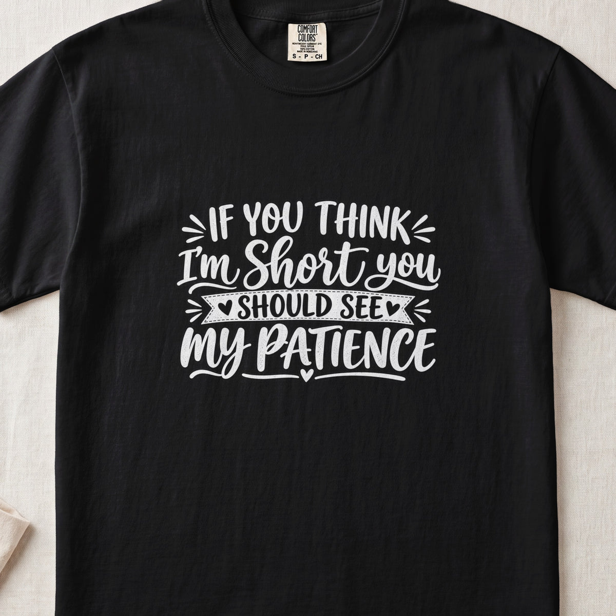 Black t-shirt with white text reading "If you think I'm short you should see my patience."