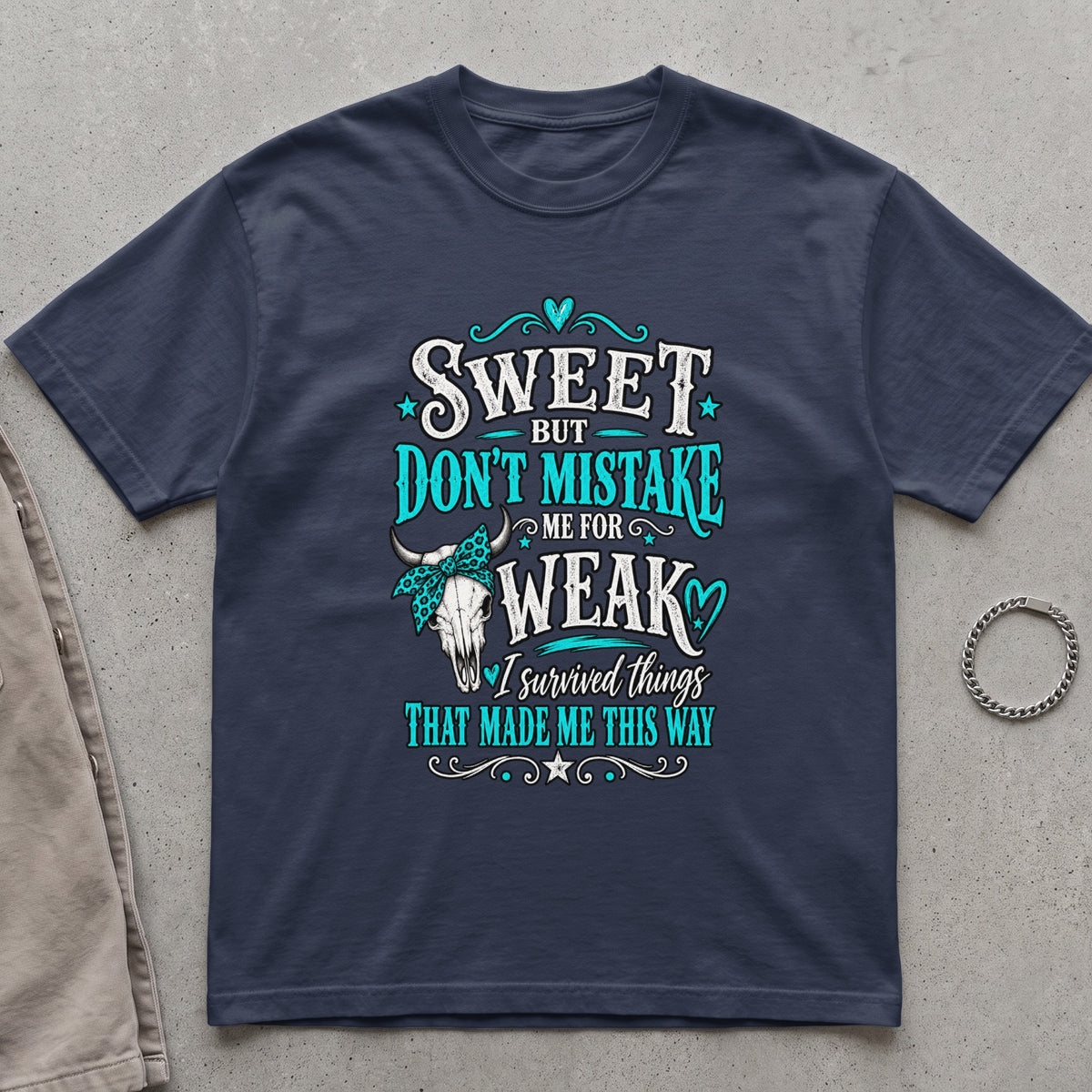 Dark blue t-shirt with skull graphic and text reading "Sweet but don't mistake me for weak".