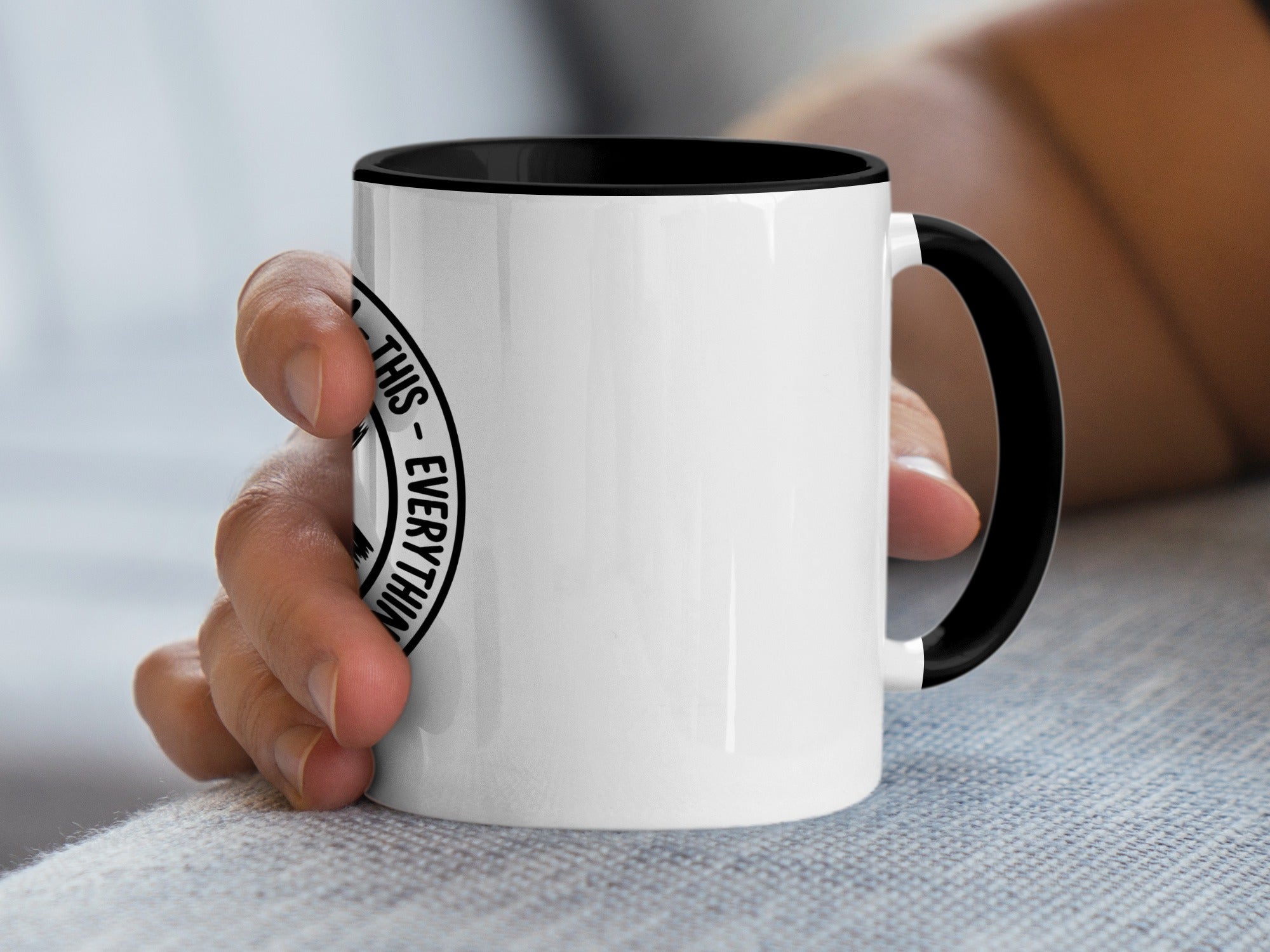 White mug with black interior and handle, featuring text "THIS - EVERYTHING".