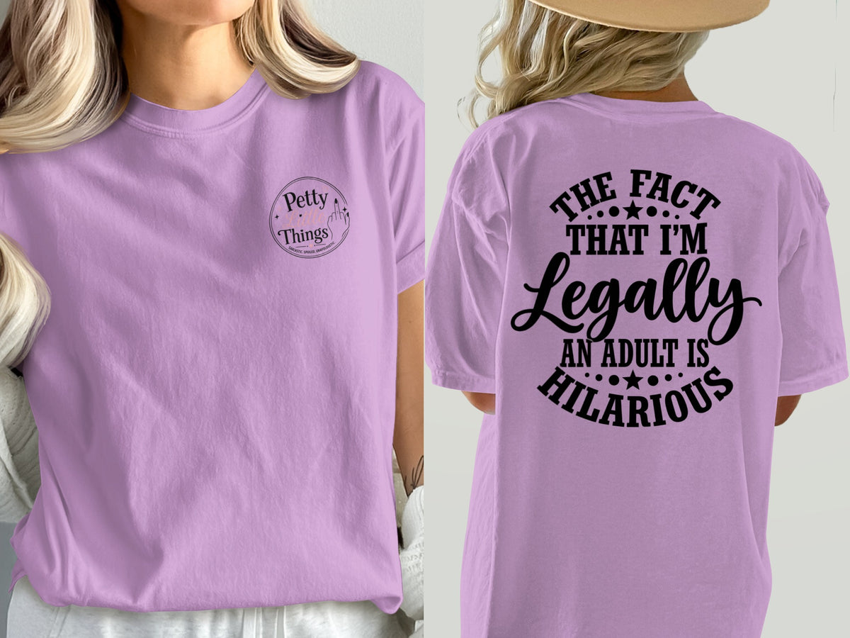 Lilac t-shirt with "Petty Things" logo and "The fact that I'm legally an adult is hilarious" graphic.