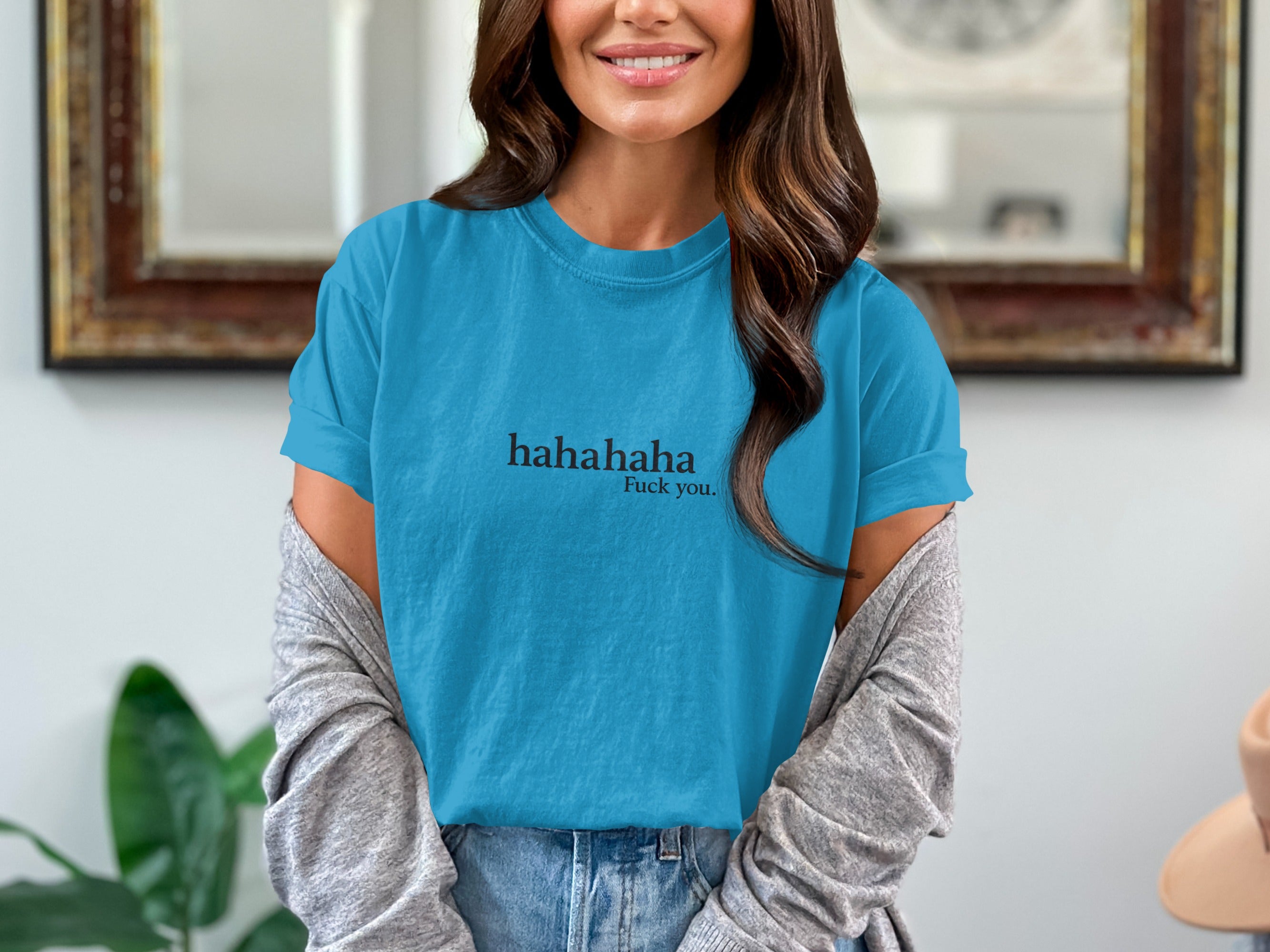 Blue t-shirt with "hahahaha Fuck you." text, worn by a woman.