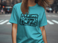 Turquoise t-shirt with black text "Adulting is some Bullshit".