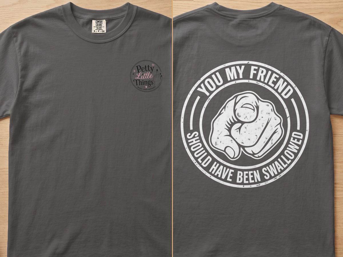 Dark gray t-shirt with "Petty Little Things" on the left chest and "You my friend should have been swallowed" on the back.