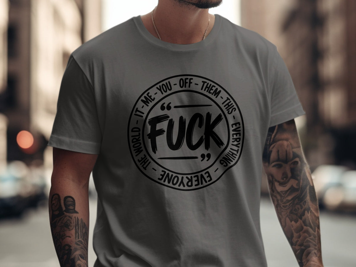 Grey t-shirt with a circular black graphic and text reading "FUCK" and "EVERYTHING - THE WORLD - IT-ME-YOU-OFF-THEM".