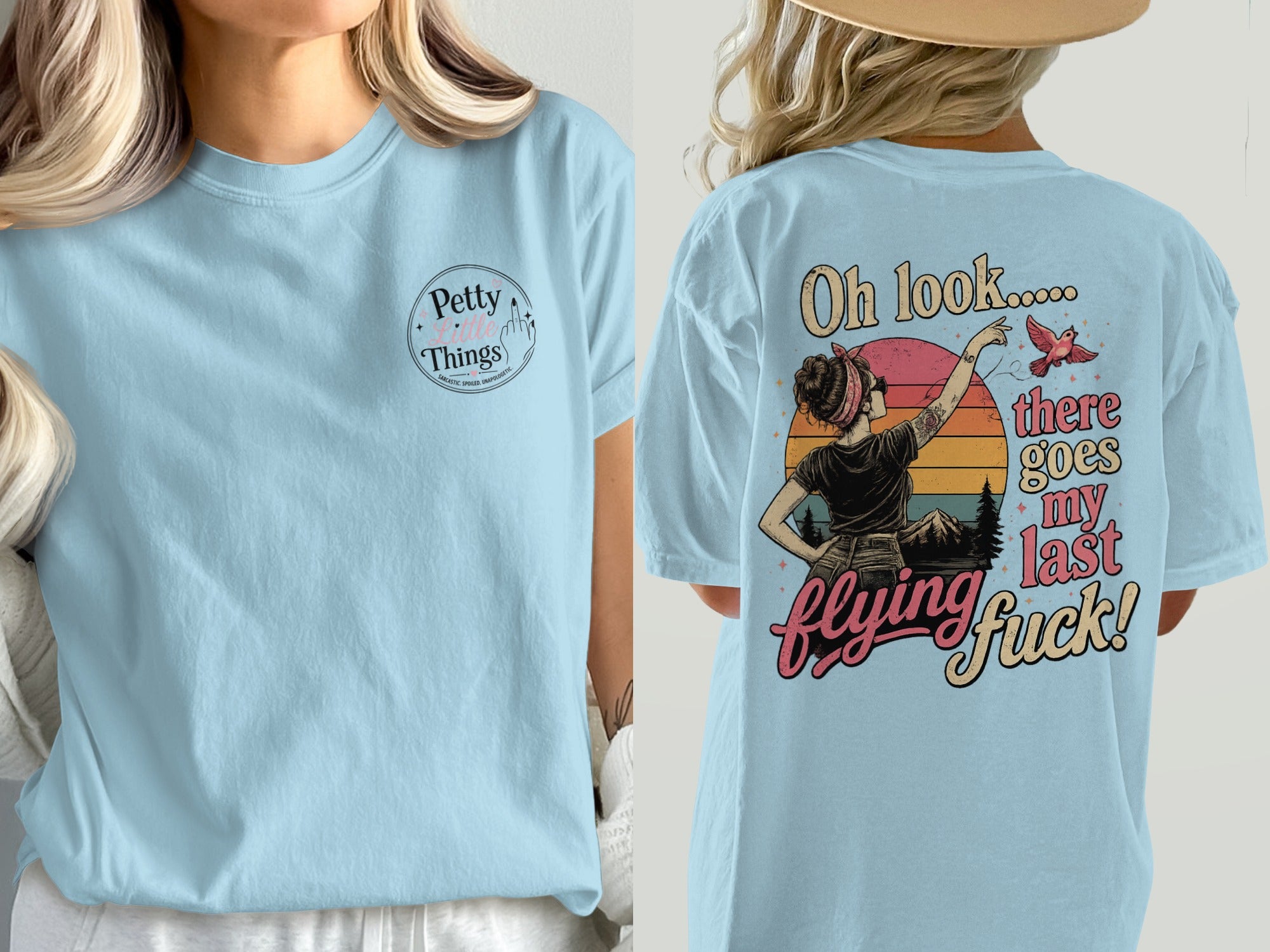 Light blue t-shirt with "Petty Little Things" on front and graphic with text on back.