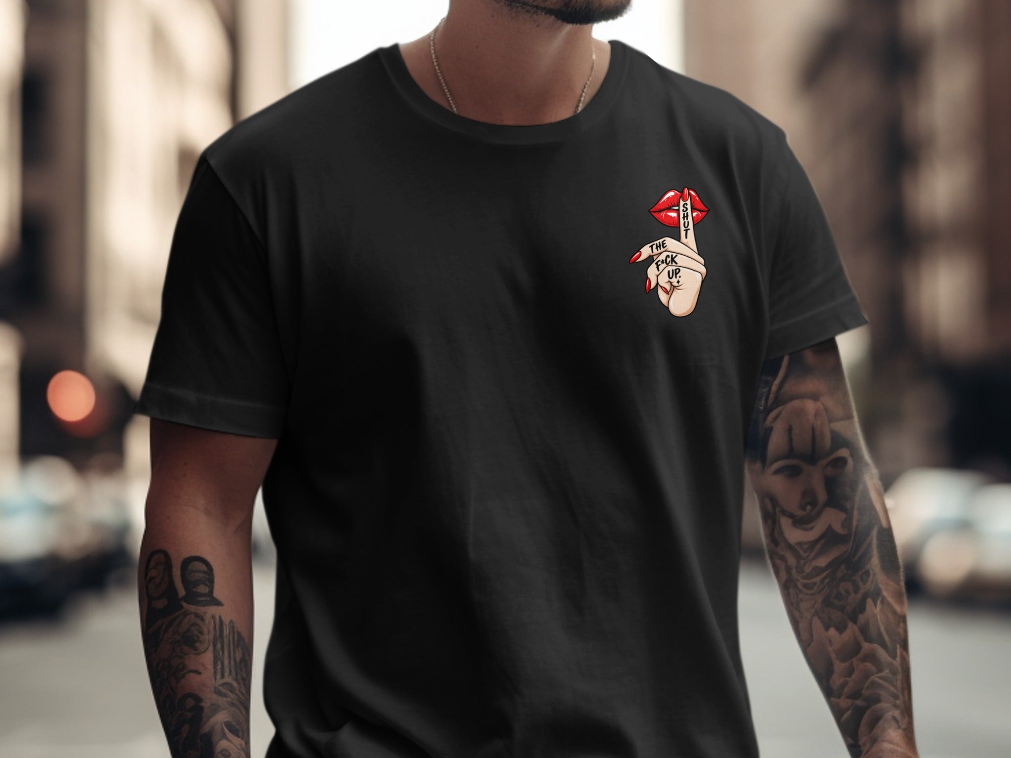 Black t-shirt with "Shut the f*ck up" graphic on the chest.