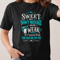 Black t-shirt with text "Sweet but don't mistake me for weak. I survived things that made me this way."