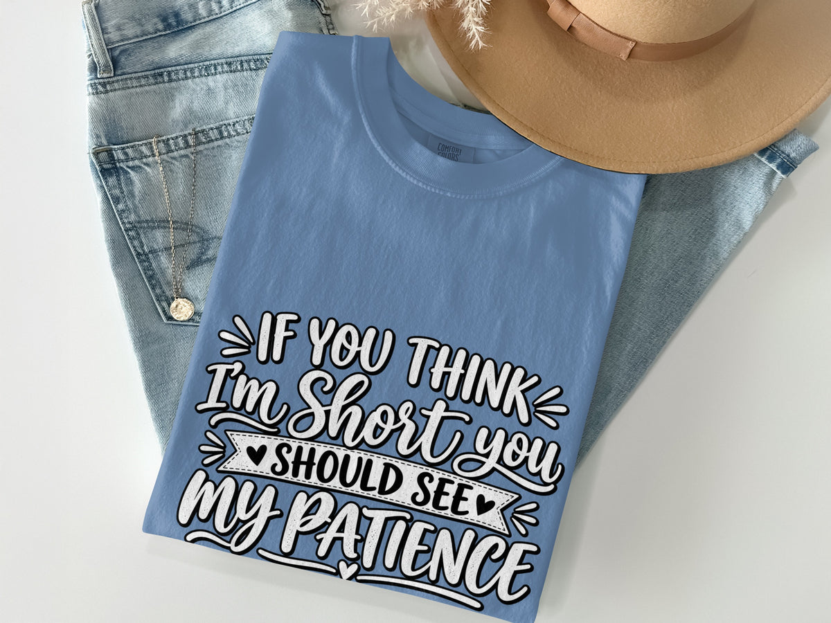 Blue t-shirt with text "If you think I'm short you should see my patience".