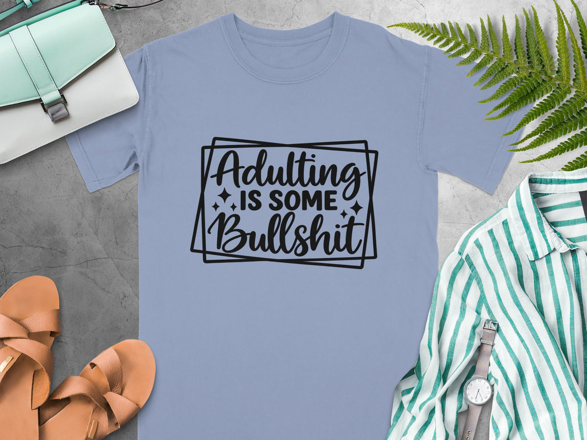 Light blue t-shirt with "Adulting is some Bullshit" text in black.