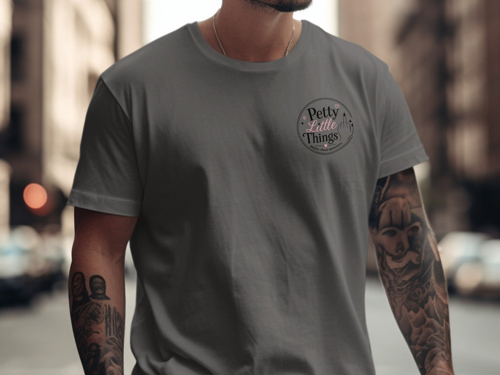 Dark grey t-shirt with "Petty Little Things" logo and "Sarcastic. Spoiled. Unapologetic." text.