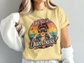 Yellow t-shirt graphic with woman looking through binoculars, text "Oh look... a Dumbass!".