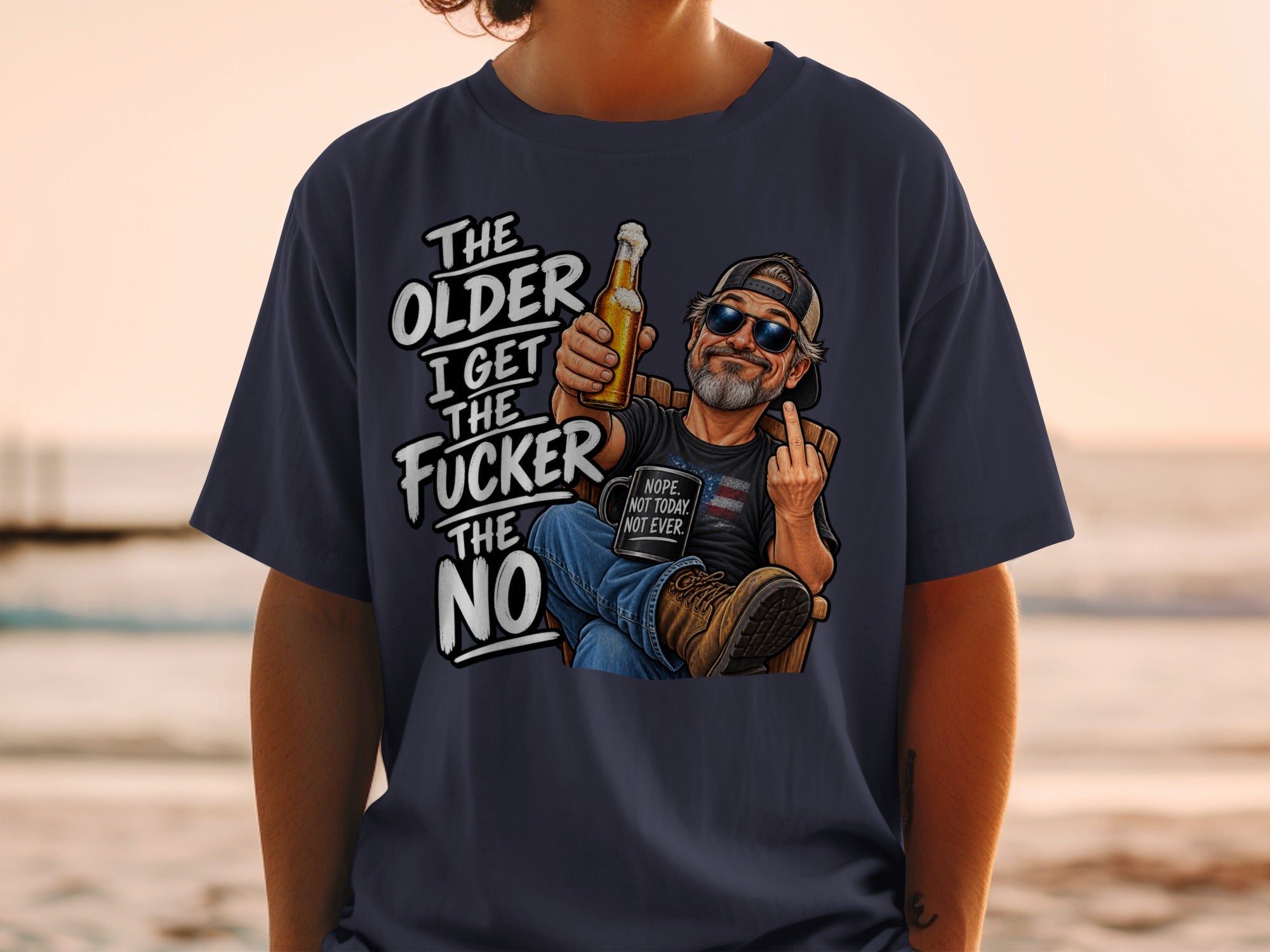 T-shirt graphic: Older I get, the fucker the no, with man holding beer and giving middle finger.