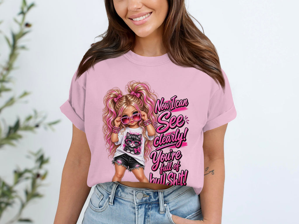 Pink t-shirt with graphic of girl and cat saying "Now I can See Clearly! You're full of bullShit!"