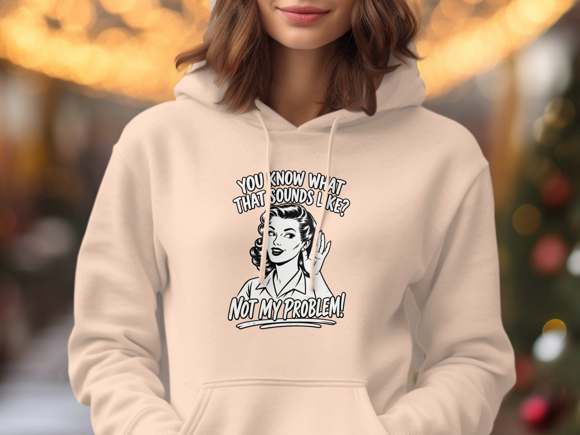 Cream hoodie with "You know what that sounds like? Not my problem!" graphic.
