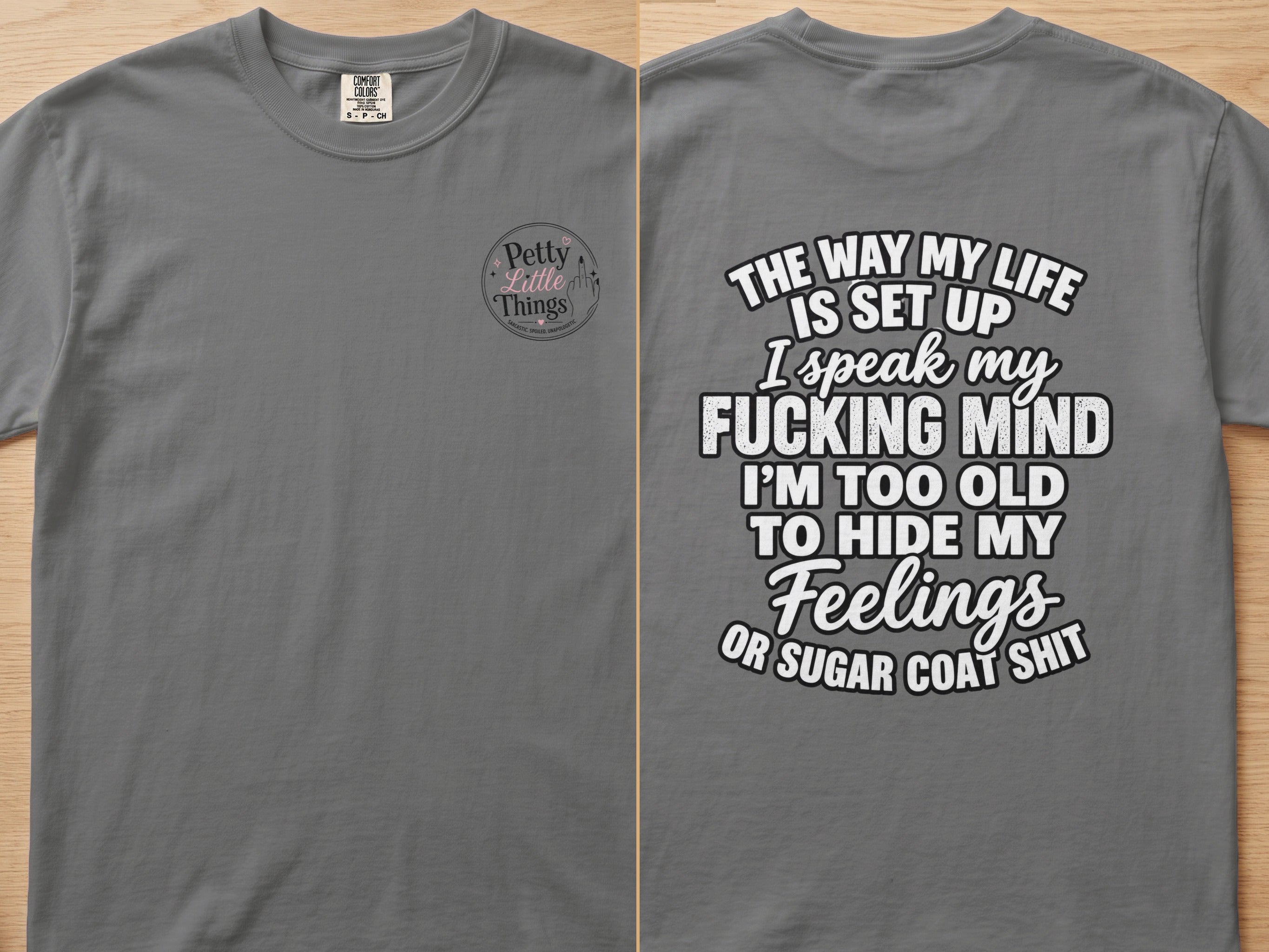 Grey t-shirt with "Petty Little Things" logo on front and quote on back.