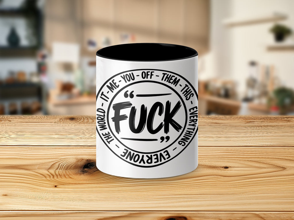 White mug with black interior and text "FUCK IT-ME-YOU-OFF-THEM-THIS-EVERYTHING THE WORLD".