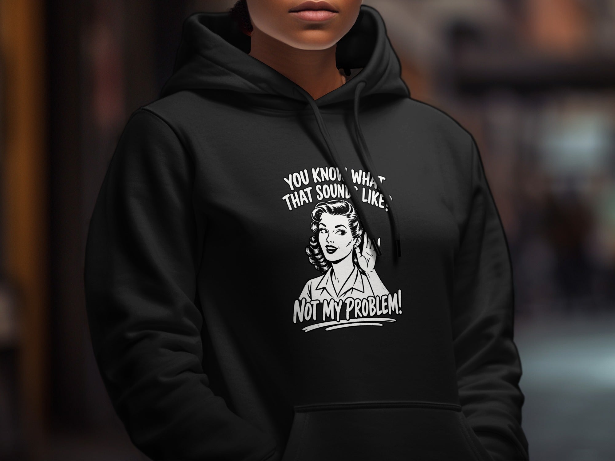 Black hoodie with a retro illustration and text: "You know what that sounds like? Not my problem!"