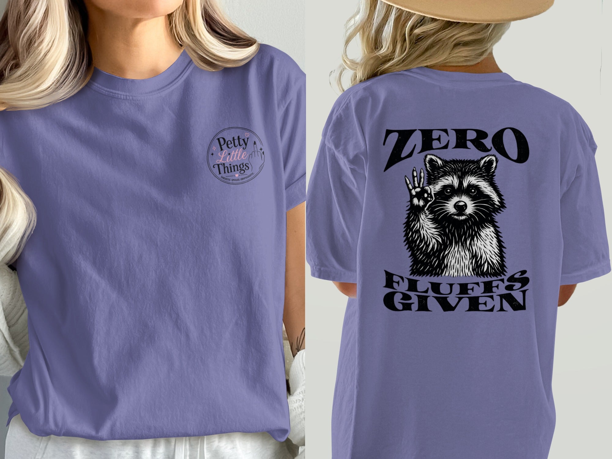 Purple t-shirt with raccoon graphic and "ZERO FLUFFS GIVEN" text on back.