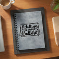 Gray spiral-bound notebook with black text "Adulting Is Some Bullshit".