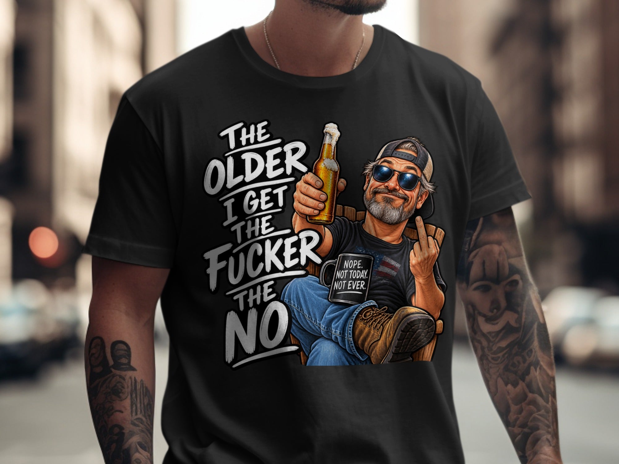 Black t-shirt graphic: older I get the fucker the no, man with beer and mug.