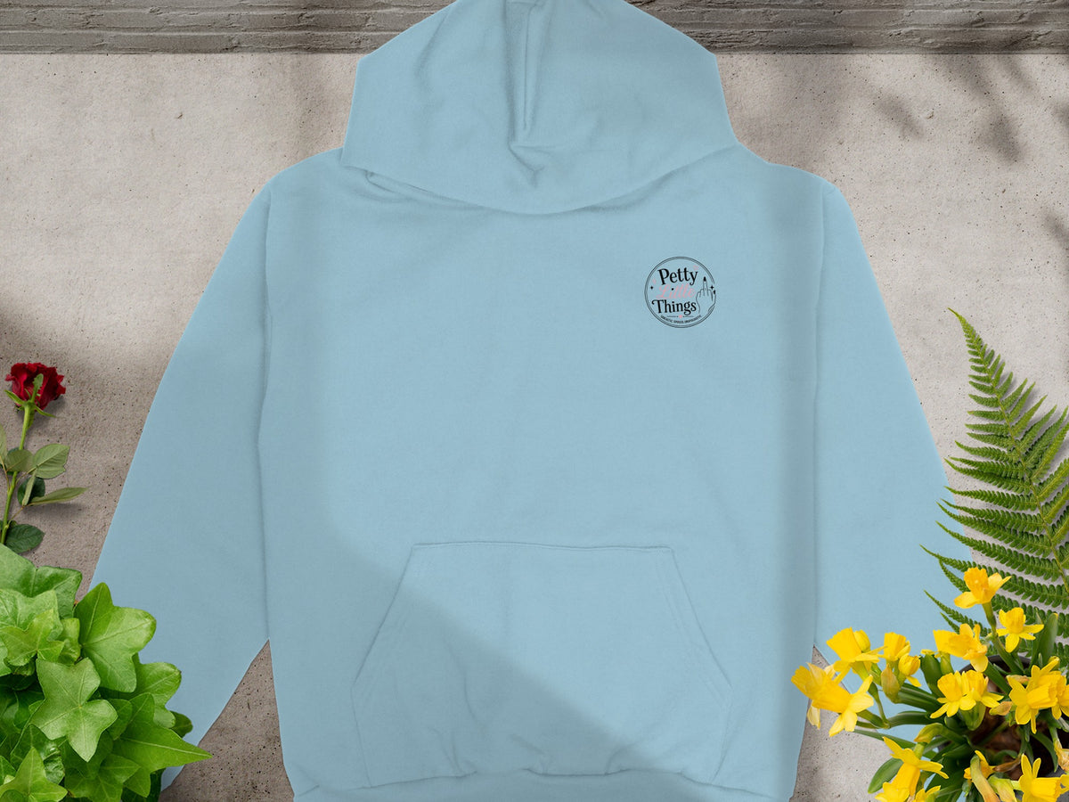 Light blue hoodie with "Petty Things" text and middle finger graphic on chest.
