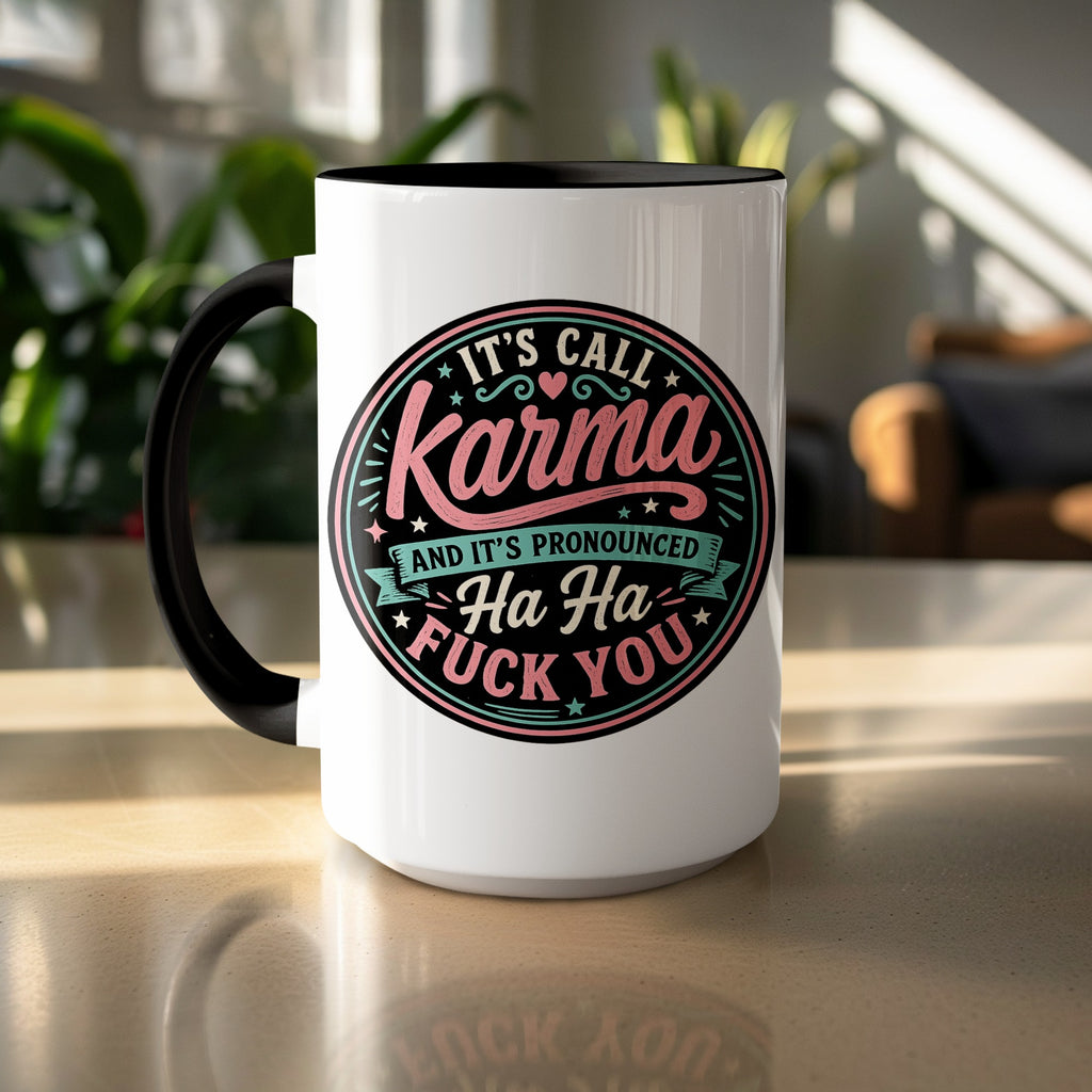 White mug with black handle featuring text: "IT'S CALL KARMA AND IT'S PRONOUNCED Ha Ha FUCK YOU".