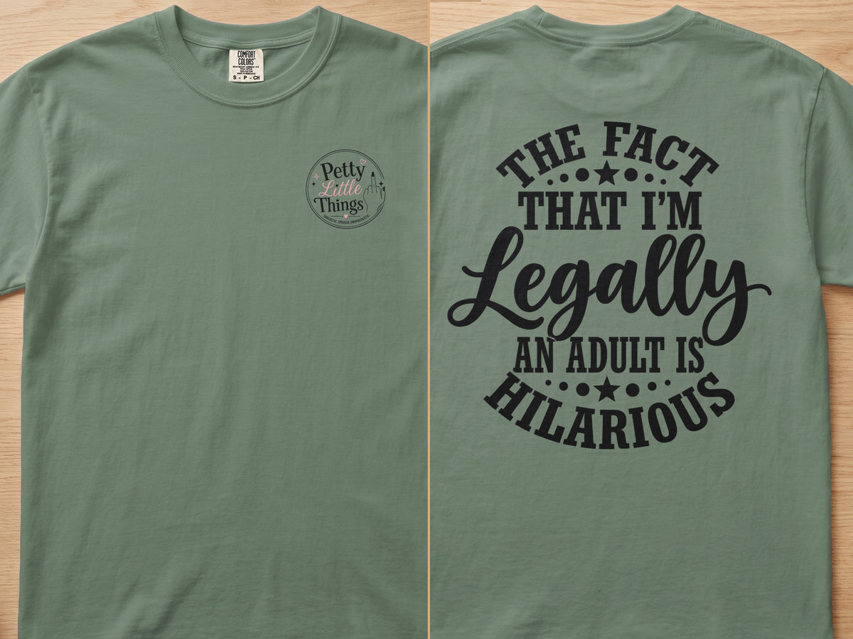 Green t-shirt with "The Fact That I'm Legally An Adult Is Hilarious" text.
