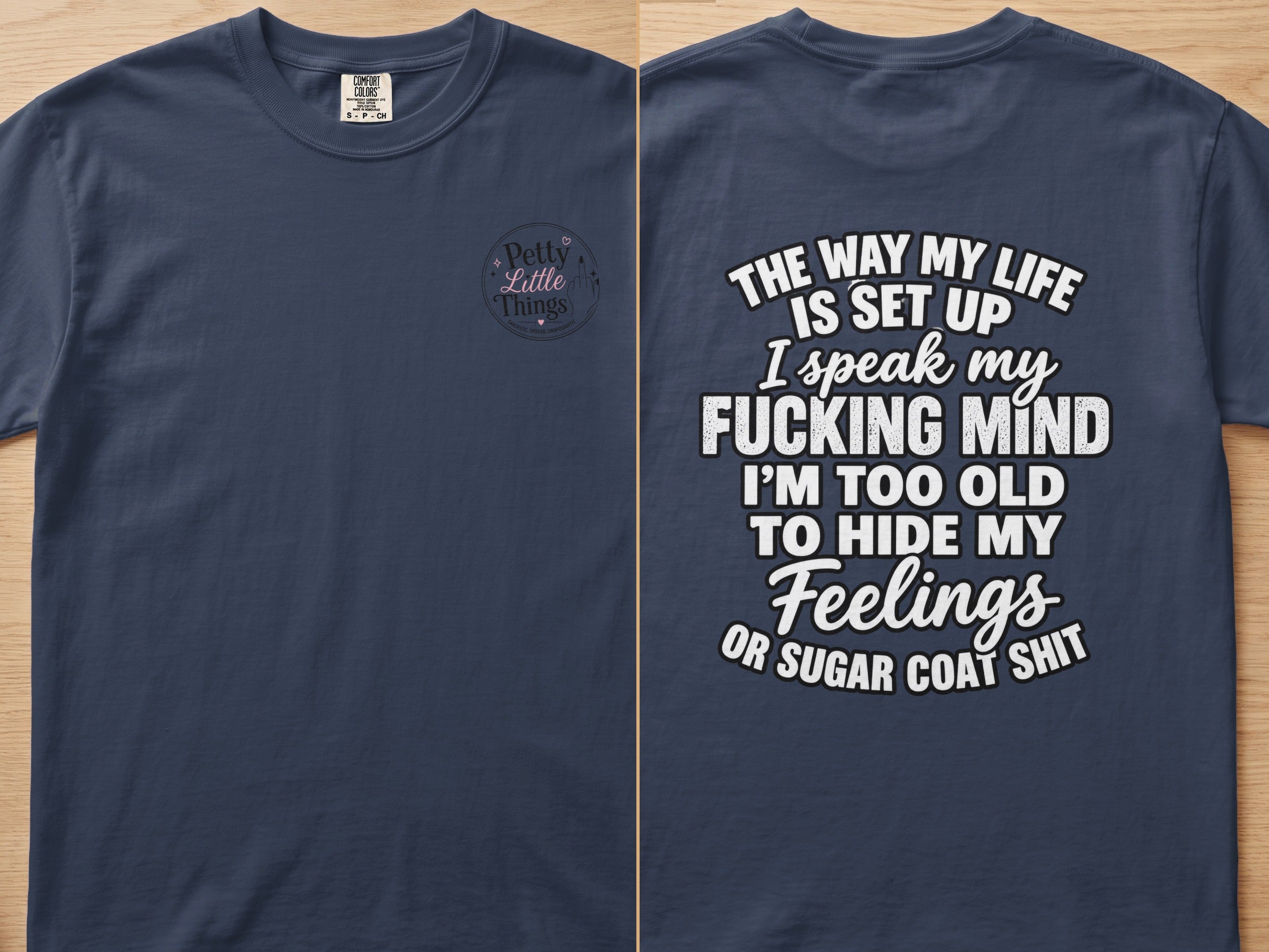 Navy t-shirt with "The Way My Life Is Set Up I Speak My Fucking Mind" text and "Petty Little Things" logo.