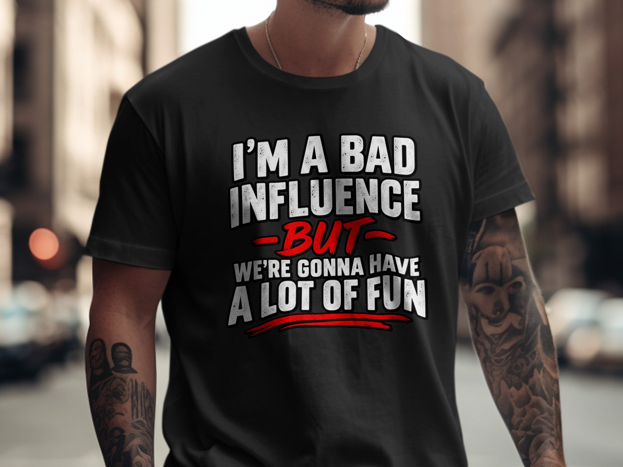 Black t-shirt with white text reading "I'M A BAD INFLUENCE BUT WE'RE GONNA HAVE A LOT OF FUN".